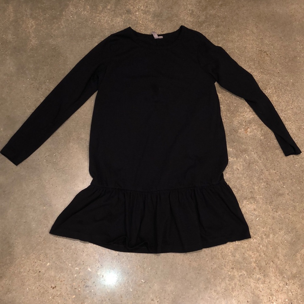 Cotton tshirt dress with ruffle detail at bottom.